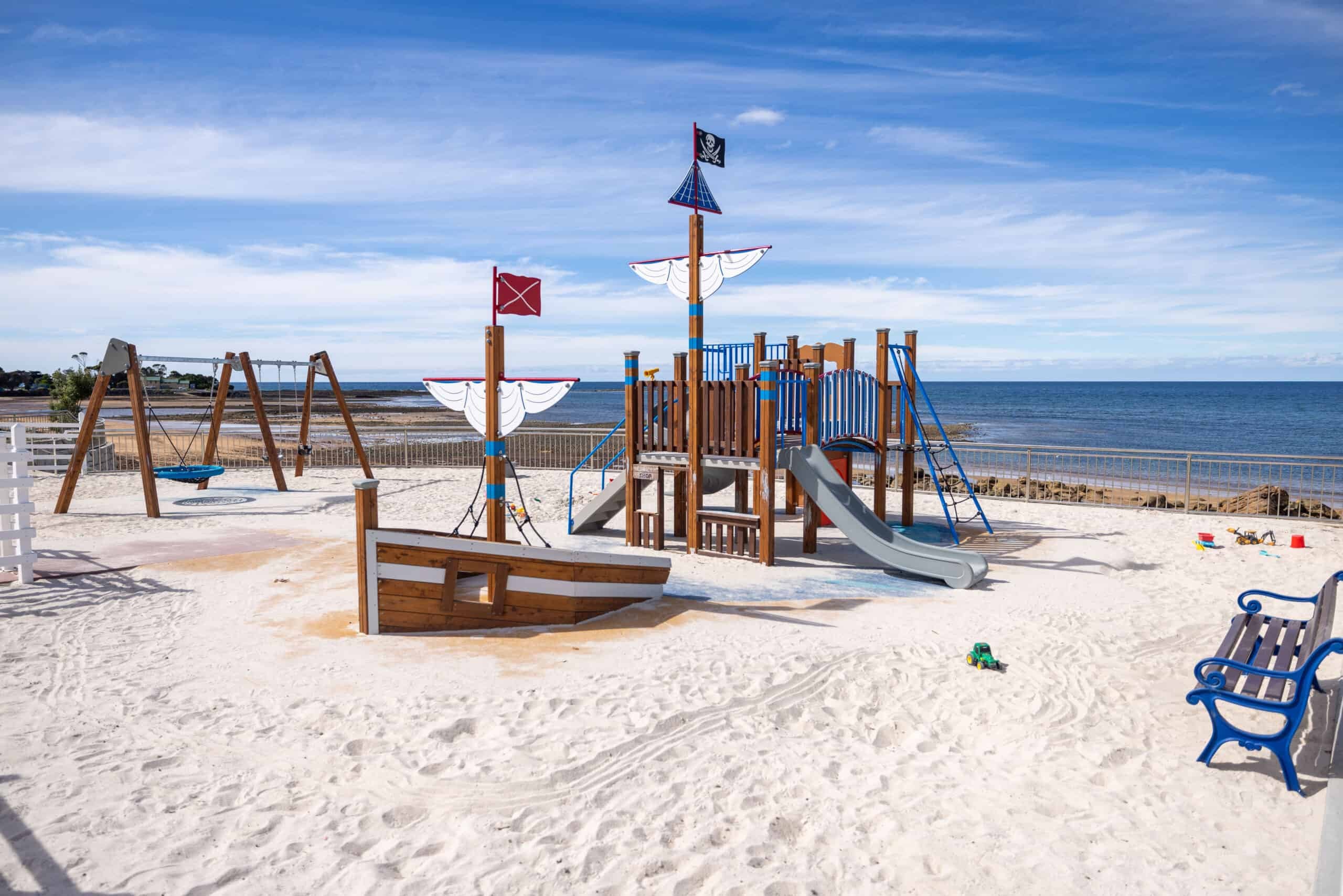 Pirate ship playground on the Penguin foreshore with white sand and ocean views
