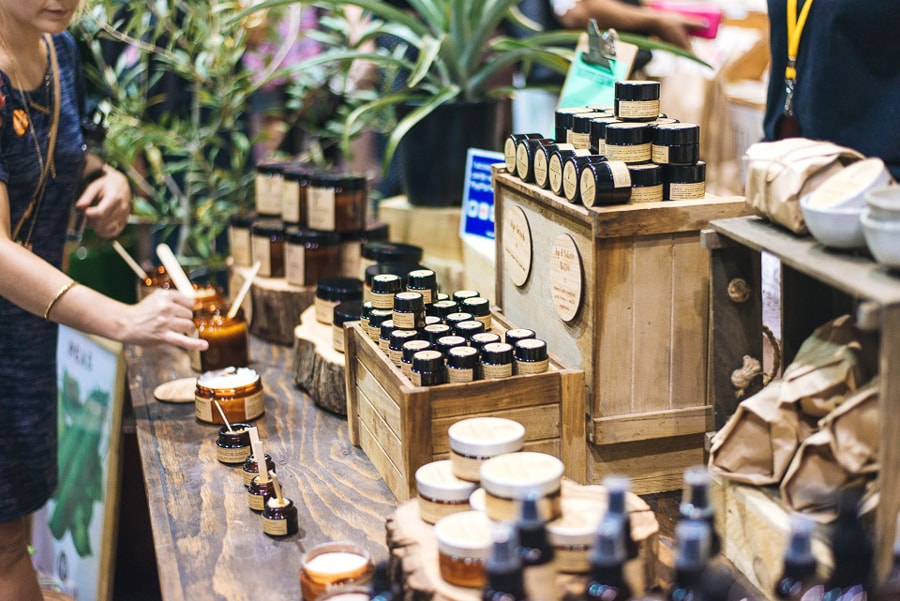 Artisan market stall with handmade products, jars and wooden displays at Penguin Undercover Markets